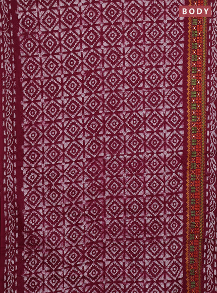 Batik cotton saree wine shade with allover batik prints and embroidery mirror work border