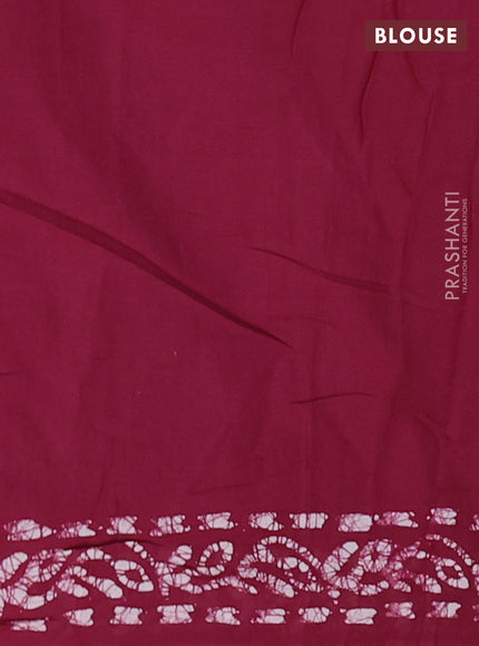 Batik cotton saree wine shade with allover batik prints and embroidery mirror work border
