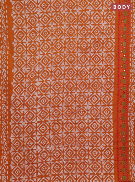 Batik cotton saree mustard yellow with allover batik prints and embroidery mirror work border