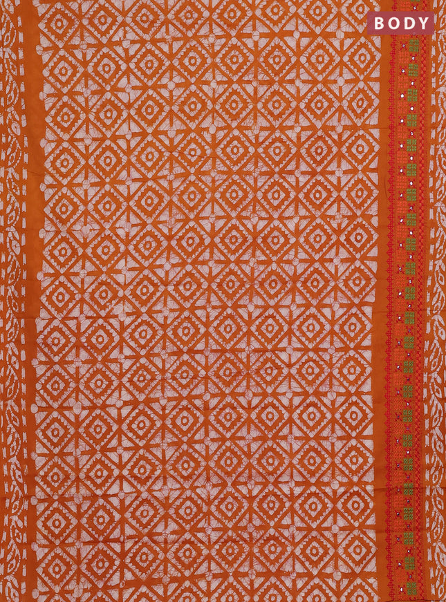 Batik cotton saree mustard yellow with allover batik prints and embroidery mirror work border