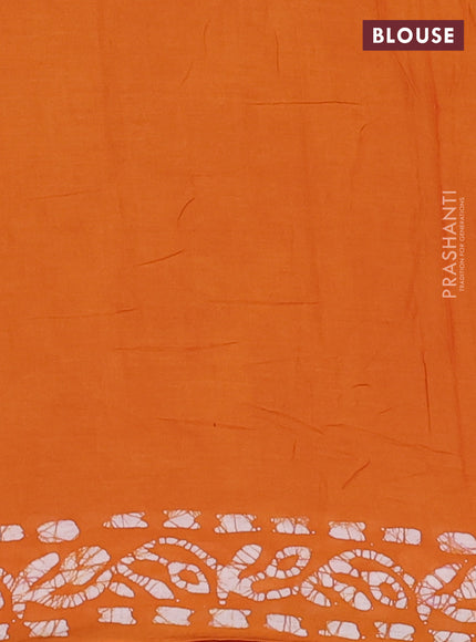 Batik cotton saree mustard yellow with allover batik prints and embroidery mirror work border