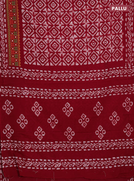 Batik cotton saree red with allover batik prints and embroidery mirror work border