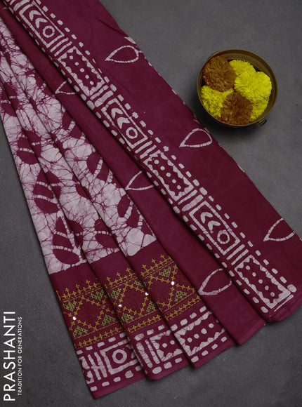 Batik cotton saree wine shade with allover batik prints and embroidery mirror work border