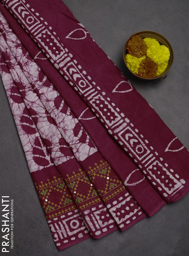 Batik cotton saree wine shade with allover batik prints and embroidery mirror work border