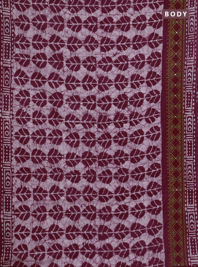 Batik cotton saree wine shade with allover batik prints and embroidery mirror work border