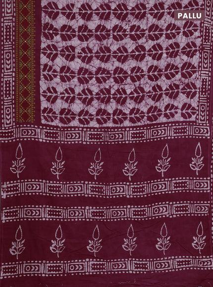 Batik cotton saree wine shade with allover batik prints and embroidery mirror work border