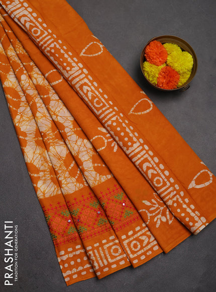 Batik cotton saree mango yellow with allover batik prints and embroidery mirror work border