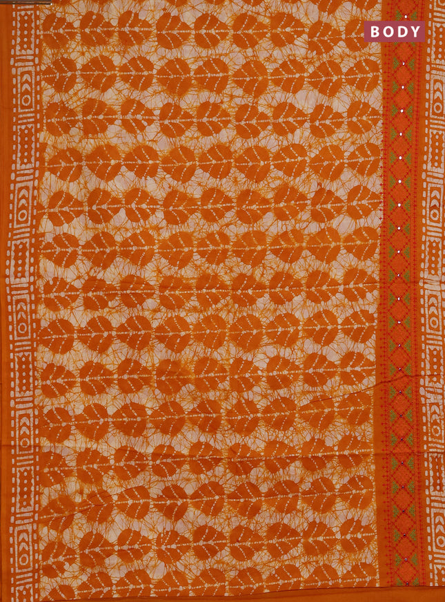 Batik cotton saree mango yellow with allover batik prints and embroidery mirror work border