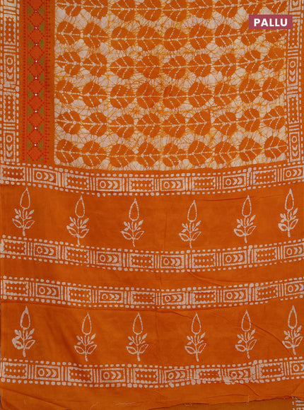 Batik cotton saree mango yellow with allover batik prints and embroidery mirror work border