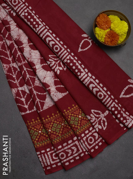 Batik cotton saree maroon with allover batik prints and embroidery mirror work border