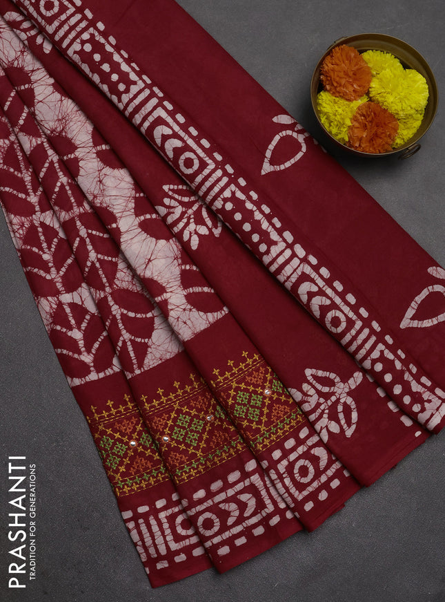 Batik cotton saree maroon with allover batik prints and embroidery mirror work border
