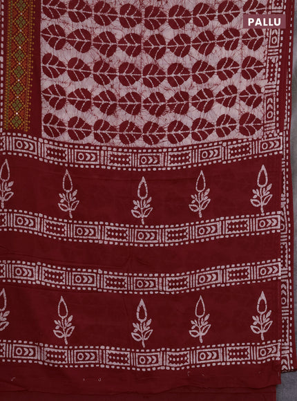 Batik cotton saree maroon with allover batik prints and embroidery mirror work border