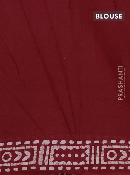 Batik cotton saree maroon with allover batik prints and embroidery mirror work border