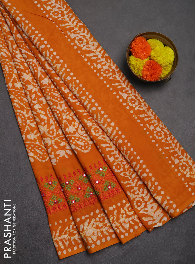 Batik cotton saree mango yellow with allover batik prints and embroidery mirror work border