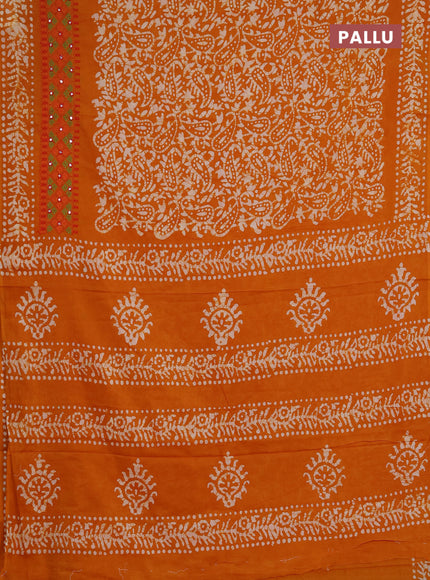 Batik cotton saree mango yellow with allover batik prints and embroidery mirror work border