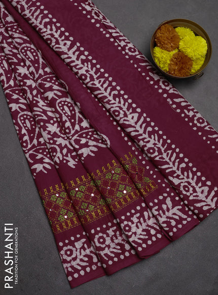 Batik cotton saree deep wine shade with allover batik prints and embroidery mirror work border