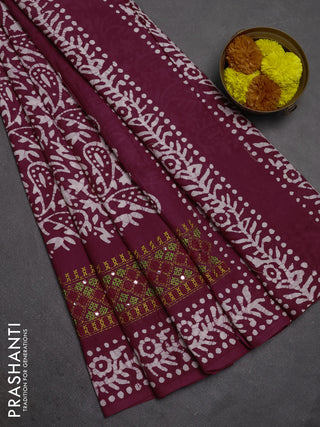 Batik cotton saree deep wine shade with allover batik prints and embroidery mirror work border