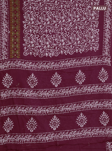 Batik cotton saree deep wine shade with allover batik prints and embroidery mirror work border