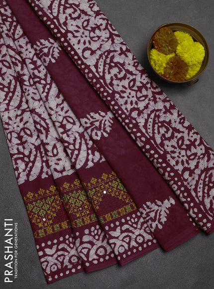 Batik cotton saree deep wine with allover batik prints and embroidery mirror work border