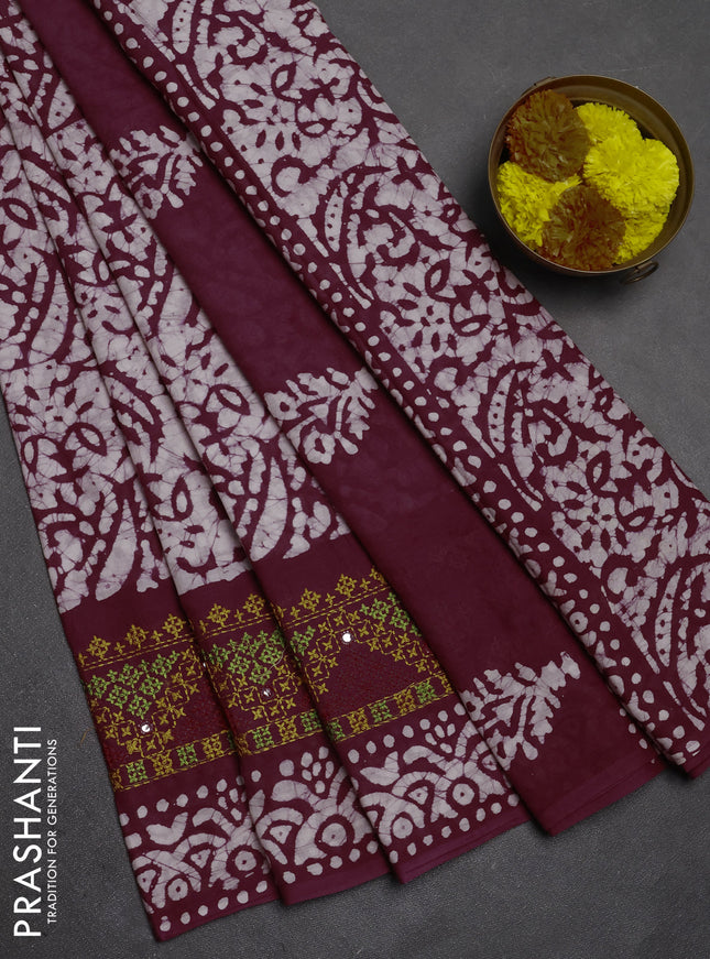 Batik cotton saree deep wine with allover batik prints and embroidery mirror work border