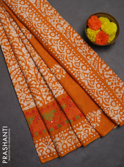 Batik cotton saree mango yellow with allover batik prints and embroidery mirror work border