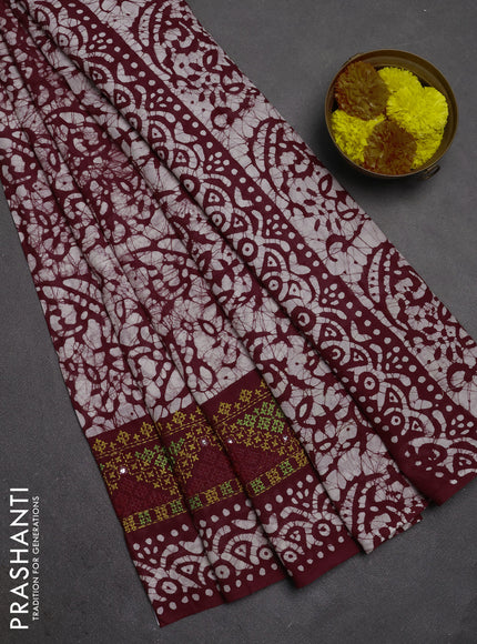 Batik cotton saree deep wine with allover batik prints and embroidery mirror work border