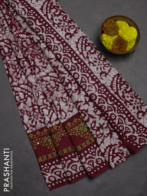 Batik cotton saree deep wine with allover batik prints and embroidery mirror work border