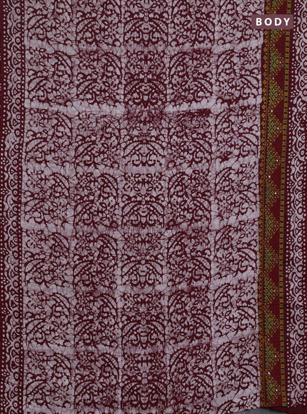 Batik cotton saree deep wine with allover batik prints and embroidery mirror work border