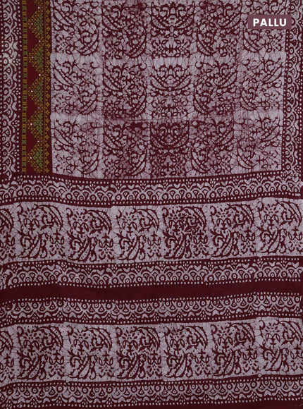 Batik cotton saree deep wine with allover batik prints and embroidery mirror work border