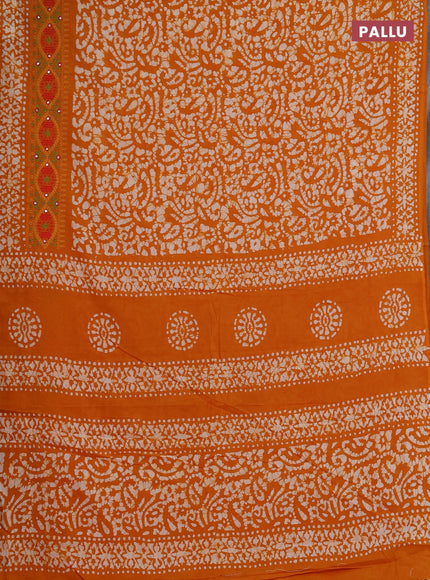 Batik cotton saree mango yellow with allover batik prints and embroidery mirror work border