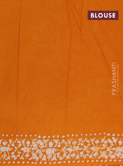 Batik cotton saree mango yellow with allover batik prints and embroidery mirror work border