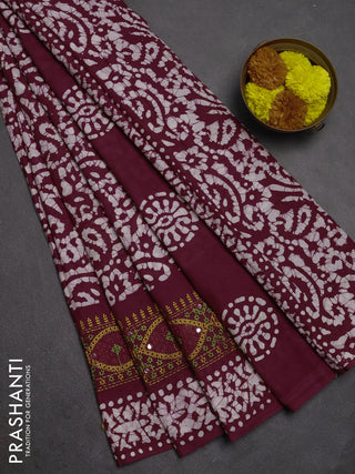 Batik cotton saree wine shade with allover batik prints and embroidery mirror work border