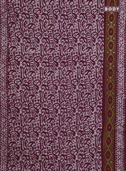 Batik cotton saree wine shade with allover batik prints and embroidery mirror work border