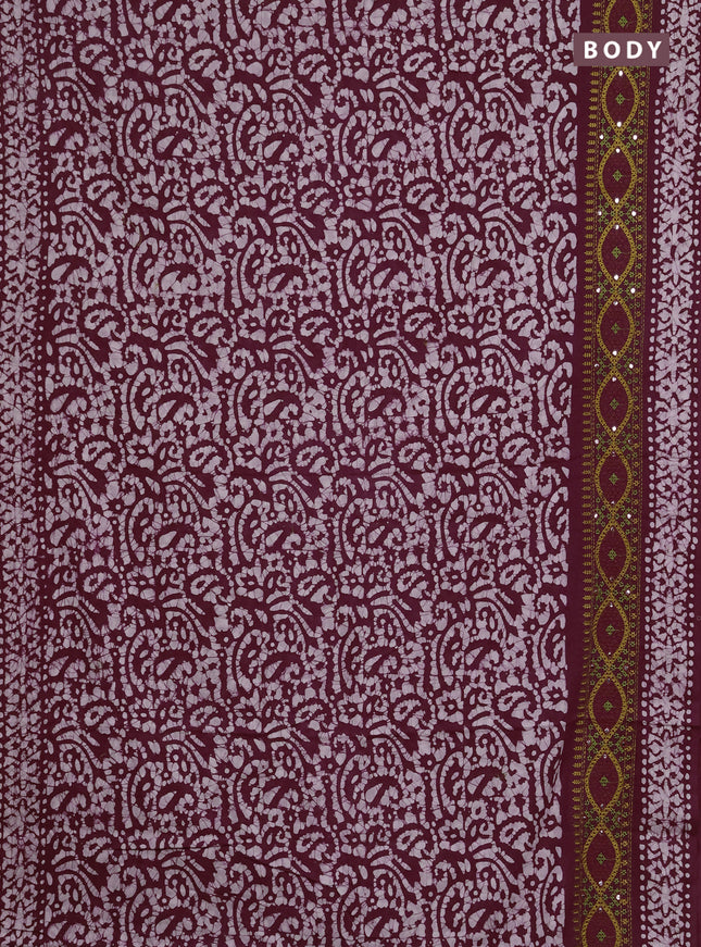 Batik cotton saree wine shade with allover batik prints and embroidery mirror work border