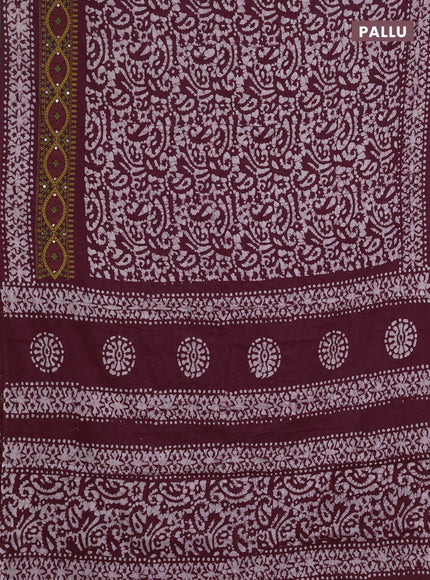 Batik cotton saree wine shade with allover batik prints and embroidery mirror work border