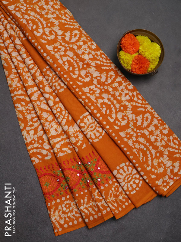 Batik cotton saree mustard yellow with allover batik prints and embroidery mirror work border