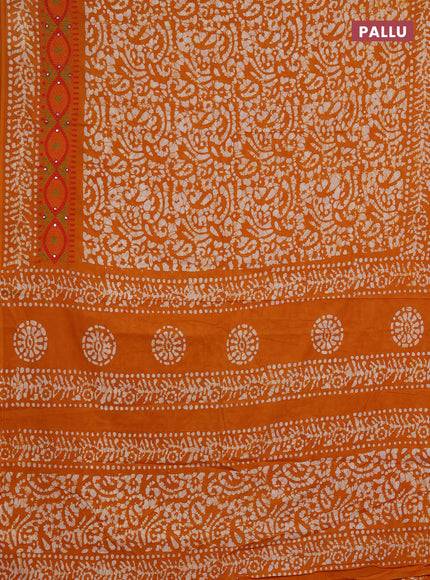 Batik cotton saree mustard yellow with allover batik prints and embroidery mirror work border