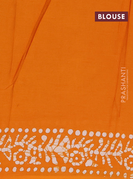 Batik cotton saree mustard yellow with allover batik prints and embroidery mirror work border