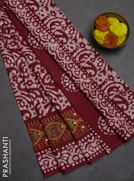 Batik cotton saree maroon with allover batik prints and embroidery mirror work border