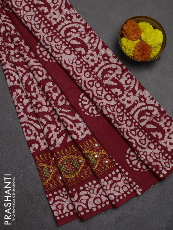 Batik cotton saree maroon with allover batik prints and embroidery mirror work border