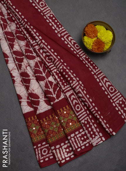 Batik cotton saree beige and red with allover batik prints and embroidery mirror work border