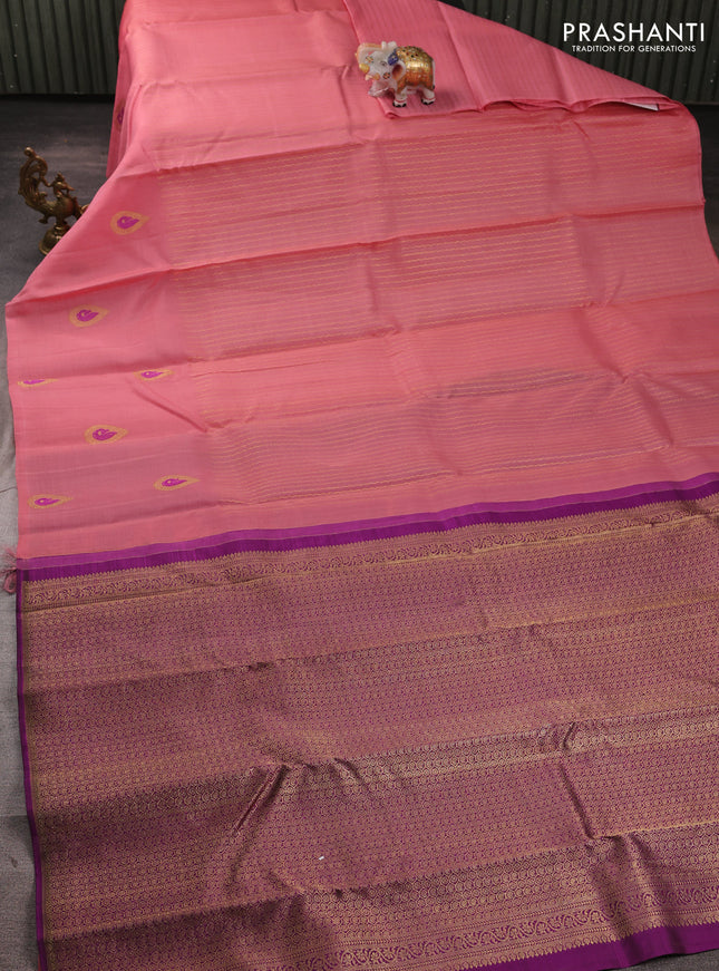 Kora kanchipuram silk saree peach pink and magenta pink with allover zari weaves pattern and long zari woven butta border