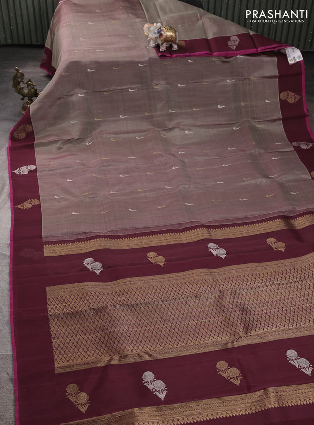Kora kanchipuram silk saree dual shade of grey and wine shade with silver & gold zari muniya buttas and zari woven floral butta border