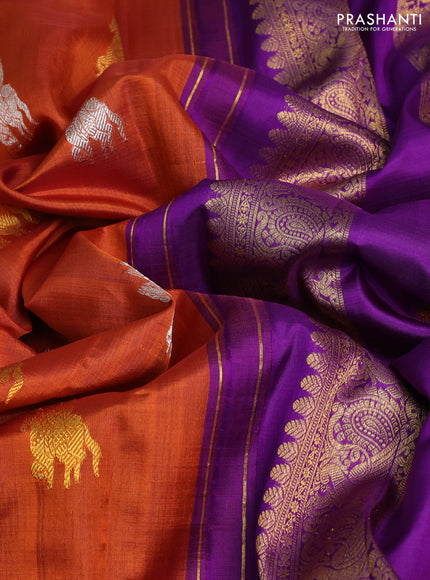 Kora kanchipuram silk saree rustic orange and purple with silver & gold zari woven buttas and rich zari woven annam border