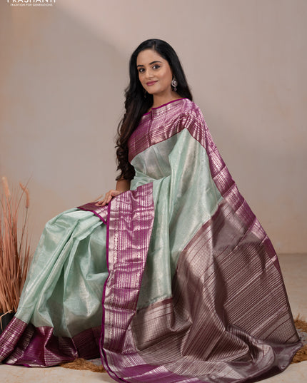 Kora kanchipuram tissue silk saree pastel blue and purple with allover zari woven brocade weaves and long zari woven border