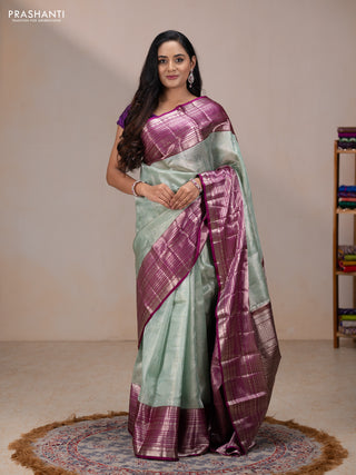 Kora kanchipuram tissue silk saree pastel blue and purple with allover zari woven brocade weaves and long zari woven border