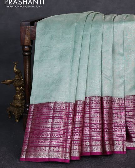 Kora kanchipuram tissue silk saree pastel blue and purple with allover zari woven brocade weaves and long zari woven border