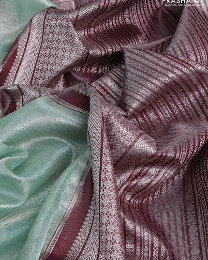 Kora kanchipuram tissue silk saree pastel blue and purple with allover zari woven brocade weaves and long zari woven border