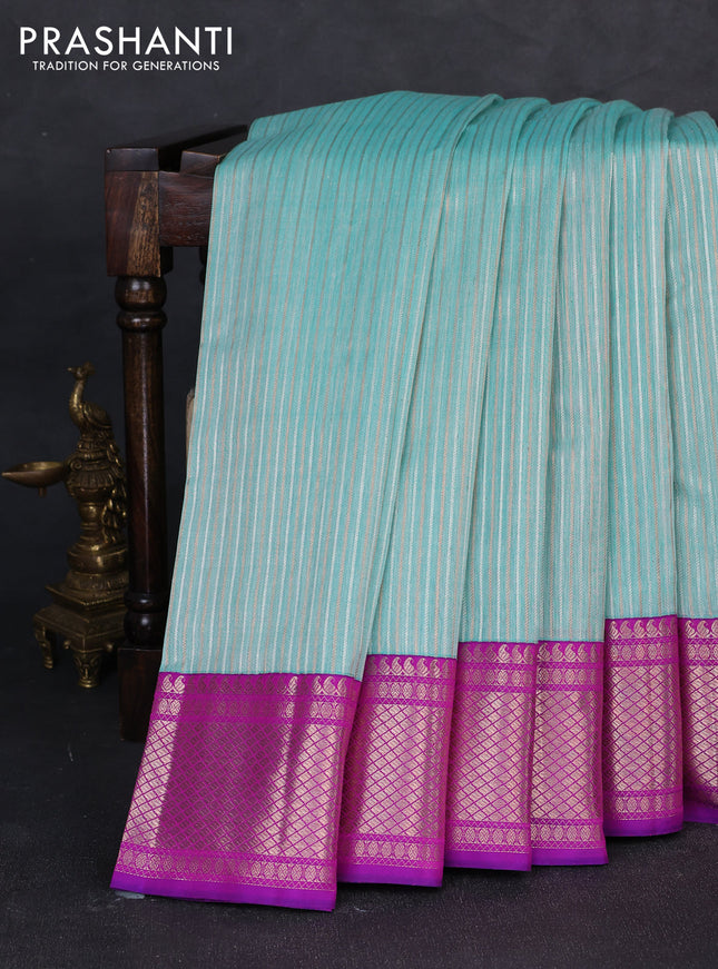 Kora kanchipuram silk saree teal blue and purple with allover silver & gold zari weaves and ganga jamuna border