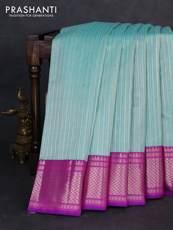 Kora kanchipuram silk saree teal blue and purple with allover silver & gold zari weaves and ganga jamuna border